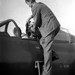 Test pilot Neville Duke in the cockpit of a Hawker Hunter jet fighter for an attempt
