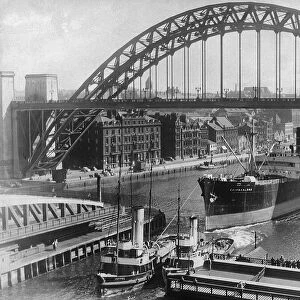 The tug Joffre towing the Cairnvalona under the Tyne Bridge and through the Swing Bridge