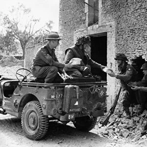WW2 White bread being delivered by British troops in jeep from a bakery behind the line