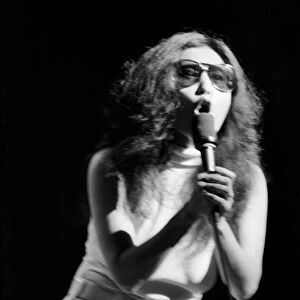Yoko Ono singing in a charity concert in New York with her husband John Lennon