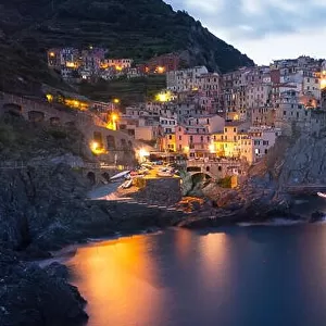 Fantastic landscape of Manarola city with costal rocks on a foreground. Cinque Terre National Park, Liguria, Italy, Europe