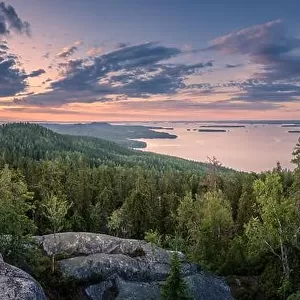 Scenic panorama landscape with lake and sunset at evening in Koli, national park, Finland