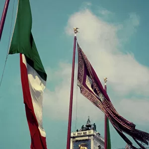 Flags in the wind with the Clock Tower in the background, Piazza San Marco, Venice