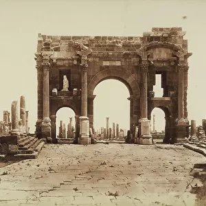 The majestic Arch of Trajan in the ancient Roman city Colonia Marciana Traiana Thamugadi, near Timgad, Algeria