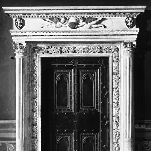 Portal of the Consistory Room in Palazzo Pubblico, Siena. The marble jambs were carried out by Bernardo Rossellino