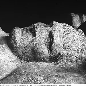 Detail of a statue of the deceased located on the sarcophagus with Trojan and Theban mythological scenes, preserved in the Gregorian Etruscan Museum, Vatican City