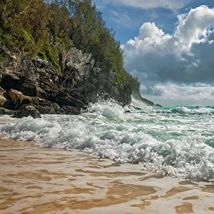 Bermuda, private beach with large rocks and crashing waves at Rosewood Bermuda Hotel