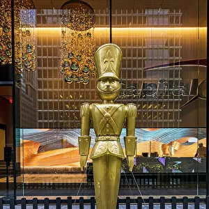 NYC, Manhattan, Midtown, lobby, golden statue of toy soldier, Christmas