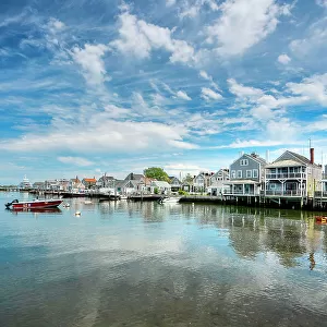 USA, Nantucket, Massachusetts, New England, shore houses, clear water, boats near to the dock, blue sky with some clouds