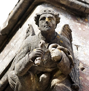 <b class=qtipBold><figcaption>Angel DP099768</figcaption></b><br>Holy Trinity Church, Chantry, Whatley, Somerset. Detail of gargoyle depicting an angel with a key and chains.<br><em>© Historic England Archive</em> Angel DP099768