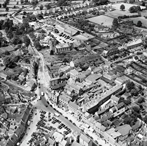 <b class=qtipBold><figcaption>Ashbourne EAW024953</figcaption></b><br>The Market Place, the Church of John the Baptist and the Cattle Market, Ashbourne, Derbyshire. Photographed by Aerofilms Ltd in July 1949.<br><em>© Historic England Archive</em> Ashbourne EAW024953