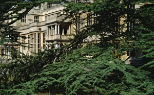 <b class=qtipBold><figcaption>Audley End House M951595</figcaption></b><br>AUDLEY END HOUSE AND GARDENS, Saffron Walden, Essex. A detail of the west face of the house looking through tree foliage.<br><em>© Historic England</em> Audley End House M951595