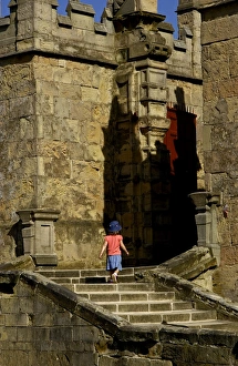 <b class=qtipBold><figcaption>Bolsover Castle N060533</figcaption></b><br>BOLSOVER CASTLE, Derbyshire. Little girl climbing the steps to the Little Castle.<br><em>© Historic England</em> Bolsover Castle N060533
