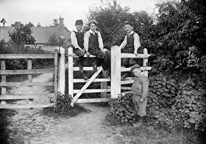 Boys sitting on gate AA97_05319
