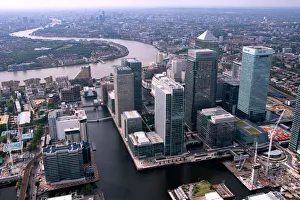 <b class=qtipBold><figcaption>Canary Wharf 24453_022</figcaption></b><br>CANARY WHARF, Docklands, London. The towers of West India Dock with the River Thames beyond.<br><em>© Historic England</em> Canary Wharf 24453_022
