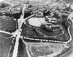 <b class=qtipBold><figcaption>Chester Castle EPW003092</figcaption></b><br>CHESTER CASTLE, Cheshire. Aerial view of Chester Castle. The forecourt complex at Chester Castle was entirely rebuilt between 1788 and 1822 by Thomas Harrison in the Neo-Classical style. A new prison was also constructed within the castle proper. Parts of the medieval castle survive including the Agricola Tower and the curtain walls. Photographed in 1920. Aerofilms Collection (see Links).<br><em>© Historic England</em> Chester Castle EPW003092