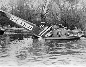 <b class=qtipBold><figcaption>Crash EPW000213</figcaption></b><br>Crashed aircraft. People in rowing boat investigating the wreckage. AVRO504K in Southwark boating lake, March 1920. From a copy negative. Aerofilms Collection (see Links).<br><em>© Historic England</em> Crash EPW000213