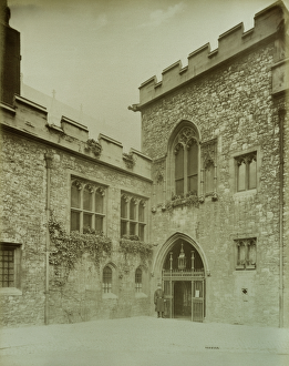 <b class=qtipBold><figcaption>Deans Yard, Westminster BL05989</figcaption></b><br>WESTMINSTER ABBEY, London. Entrance to the cloisters from Deans Yard with a policeman standing beside the gate. Photographed in 1886 by Bedford Lemere.<br><em>© Historic England</em> Deans Yard, Westminster BL05989