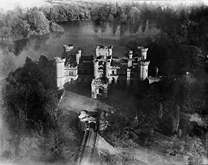 <b class=qtipBold><figcaption>Eastnor Castle EPW005398</figcaption></b><br>EASTNOR CASTLE, near Ledbury, Herefordshire. Aerial view of Eastnor Castle, built in 1812-20 by Robert Smirke to look like a medieval castle. Photographed in March 1921. Aerofilms Collection (see Links).<br><em>© Historic England</em> Eastnor Castle EPW005398