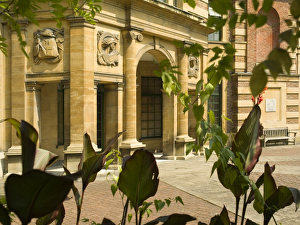 <b class=qtipBold><figcaption>Eltham Palace N060935</figcaption></b><br>ELTHAM PALACE, Greenwich, London. A view of the loggia through foliage.<br><em>© Historic England</em> Eltham Palace N060935