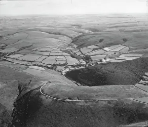 <b class=qtipBold><figcaption>Exmoor RAF_540_846_PFFO_0112</figcaption></b><br>County Gate and Cosgate Hill, Exmoor, Devon. An aerial view of County Gate and Cosgate Hill before moorland improvement and forestry planning. Photographed by the RAF in August 1952.<br><em>© Historic England Archive</em> Exmoor RAF_540_846_PFFO_0112