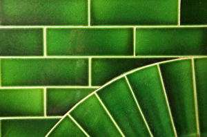 <b class=qtipBold><figcaption>Fireplace tiles DP031586</figcaption></b><br>Interior detailed view of green fireplace tiles.<br><em>© Historic England</em> Fireplace tiles DP031586