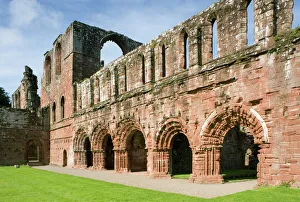 <b class=qtipBold><figcaption>Furness Abbey N080538</figcaption></b><br>FURNESS ABBEY, Cumbria. View of the five round headed arches that run along the east wall of the Cloister.<br><em>© Historic England</em> Furness Abbey N080538