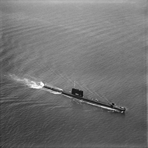 <b class=qtipBold><figcaption>HMS Grampus EAW103445</figcaption></b><br>HMS Grampus off Portsmouth. July 1962. Grampus was a Porpoise-class submarine of the Royal Navy, launched in 1957. Aerofilms Collection.<br><em>© Historic England</em> HMS Grampus EAW103445