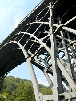 <b class=qtipBold><figcaption>Iron Bridge N060048</figcaption></b><br>IRON BRIDGE, Shropshire. A section of the famous cast iron bridge. Designed by Thomas Pritchard and built in 1779 by Abraham Darby III of the Coalbrookdale Company.<br><em>© Historic England</em> Iron Bridge N060048