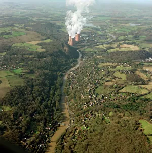 <b class=qtipBold><figcaption>Ironbridge Gorge 21131_07</figcaption></b><br>Ironbridge Gorge and Buildwas Power Station, Shropshire. The cradle of the Industrial Revolution. Abraham Darby established his iron works at Coalbrookdale in 1708, and in 1778 the first cast-iron bridge in the world, almost an icon of the Industrial Revolution, was erected here (towards the centre of the photograph). This industrial area sits among the greenery of this largely rural county. Photographed in February 2001.<br><em>© Historic England Archive</em> Ironbridge Gorge 21131_07