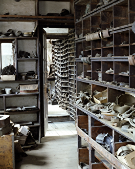 <b class=qtipBold><figcaption>J. W. Evans N030024</figcaption></b><br>J.W.EVANS, Birmingham, West Midlands. Silversmiths factory. Interior view. Storage shelves along the side of the first floor lobby between the old stock room and fly press room 2 - number 55.<br><em>© Historic England</em> J. W. Evans N030024