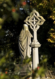 <b class=qtipBold><figcaption>Kensal Green Cemetery N071387</figcaption></b><br>KENSAL GREEN CEMETERY, London. View through the trees towards graveyard monuments.<br><em>© Historic England</em> Kensal Green Cemetery N071387