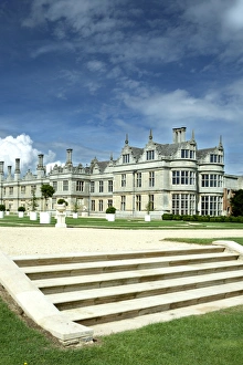 <b class=qtipBold><figcaption>Kirby Hall N071550</figcaption></b><br>KIRBY HALL, Northamptonshire. General view of house and gardens with steps in foreground.<br><em>© Historic England</em> Kirby Hall N071550