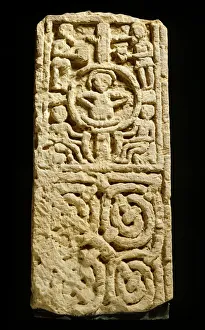 <b class=qtipBold><figcaption>Lindisfarne Viking stone J870085</figcaption></b><br>LINDISFARNE PRIORY, Northumberland. Viking stone. A 10th century carved cross-shaft of the kind that would have stood on the cross base now in the north transept. The central figure may represent Christ in Judgement.<br><em>© Historic England</em> Lindisfarne Viking stone J870085