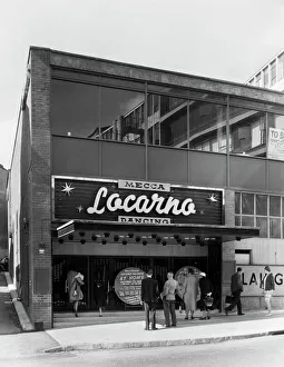 <b class=qtipBold><figcaption>Locarno, Birmingham JLP01_08_058073</figcaption></b><br>LOCARNO BALLROOM, Hurst Street, Birmingham. Entrance to the Locarno Mecca Ballroom, with members of the public reading the signage. 25th August 1960. Nightclub. John Laing Collection.<br><em>© Historic England</em> Locarno, Birmingham JLP01_08_058073