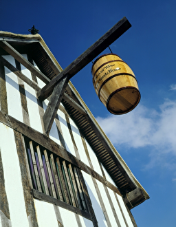 <b class=qtipBold><figcaption>Medieval Merchants House J880160</figcaption></b><br>MEDIEVAL MERCHANT'S HOUSE, Southampton, Hampshire. Exterior close-up of the 13th century town house showing barrel hanging from timber beam.<br><em>© Historic England</em> Medieval Merchants House J880160