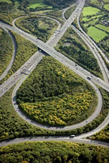 <b class=qtipBold><figcaption>Motorway junction N071919</figcaption></b><br>BROADSPRING WOOD, Fulmer, Buckinghamshire. Aerial view. Junction 1A on the M40 joining the M25 motorway between Uxbridge and Gerrards Cross.<br><em>© Historic England</em> Motorway junction N071919