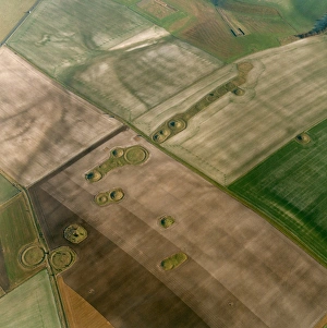 <b class=qtipBold><figcaption>Normanton Down 18663_20</figcaption></b><br>Normanton Down, Wilsford cum Lake, Wiltshire. Aerial view showing the remains of barrows in the landscape around Normanton Down in Wiltshire. Ploughing around the monuments has left them on unploughed islands. Photographed in January 2000.<br><em>© Historic England Archive</em> Normanton Down 18663_20