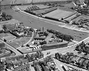 <b class=qtipBold><figcaption>Nottingham EPW041578</figcaption></b><br>The City Ground, West Bridgeford, Nottingham. Home of Nottingham Forest Football Club since 1898. In the foreground is the Turney Bros Ltd Leather Works alongside the River Trent. Photographed by Aerofilms Ltd in June 1933.<br><em>© Historic England Archive</em> Nottingham EPW041578