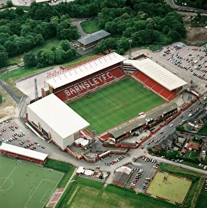 <b class=qtipBold><figcaption>Oakwell, Barnsley EAW685521</figcaption></b><br>OAKWELL stadium, Barnsley. Aerial view of the home of Barnsley Football Club. Photographed in 2000, the year when the Tykes reached the last ever play-off final at the old Wembley. Aerofilms Collection (see Links).<br><em>© Historic England</em> Oakwell, Barnsley EAW685521