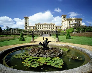 <b class=qtipBold><figcaption>Osborne House K040211</figcaption></b><br>OSBORNE HOUSE, Isle of Wight. A view of the house with the fountain Geiss of bronze boy and swan.<br><em>© Historic England</em> Osborne House K040211