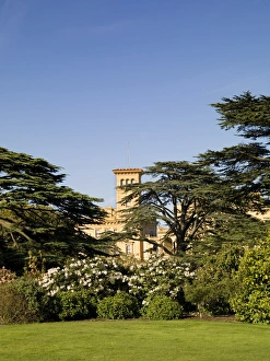 <b class=qtipBold><figcaption>Osborne House N071189</figcaption></b><br>OSBORNE HOUSE, Isle of Wight. General view from the gardens, through the trees, towards the house.<br><em>© Historic England</em> Osborne House N071189