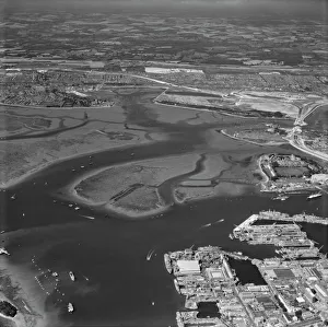 <b class=qtipBold><figcaption>Portsmouth Harbour EAW280874</figcaption></b><br>Portsmouth Harbour. Looking across the harbour and naval dockyards towards Porchester. Photographed by Aerofilms Ltd in July 1974.<br><em>© Historic England Archive</em> Portsmouth Harbour EAW280874