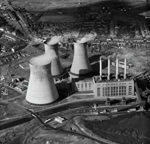<b class=qtipBold><figcaption>Power Station EAR030695</figcaption></b><br>OCKER HILL POWER STATION, Tipton, Staffordshire. Aerial view of a coal-fired power station with three cooling towers emitting steam. It was opened in 1902 to supply power to the Black Country. It closed in 1977 and the site is occupied by a housing estate built in the 1990s. Photographed by Aeropictorial in 1957. Aerofilms Collection (see Links).<br><em>© Historic England</em> Power Station EAR030695