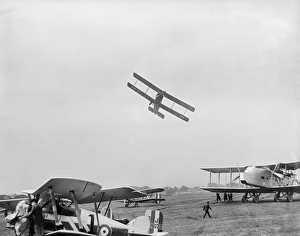 <b class=qtipBold><figcaption>RAF Pageant EPW018790</figcaption></b><br>HENDON, Barnet. An Avro 504 aircraft flying very low over parked aircraft at the RAF Pageant of 1927. The parked aircraft are a Gloster Gamecock Mk.I, Short Springbock II, and Handley Page Hyderabad. Photographed by Aerofilms in July 1927. Aerofilms Collection (see Links).<br><em>© Historic England</em> RAF Pageant EPW018790