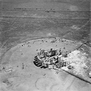 <b class=qtipBold><figcaption>Restoring Stonehenge EAW072757</figcaption></b><br>Stonehenge, Wiltshire. Photographed in July 1958 with restoration works in progress. Aerofilms Collection.<br><em>© Historic England</em> Restoring Stonehenge EAW072757