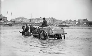 <b class=qtipBold><figcaption>Shoreham harbour BB060003</figcaption></b><br>Shoreham By Sea, West Sussex. A partly-submerged horse-drawn ballast cart in the sea off Shoreham Harbour. Photographed by E J Bedford between 1905 and 1925.<br><em>© Historic England Archive</em> Shoreham harbour BB060003