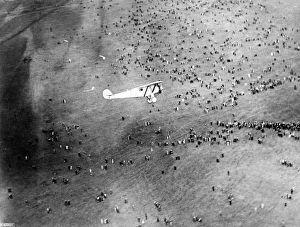 <b class=qtipBold><figcaption>Spirit of St Louis EPW018121</figcaption></b><br>Charles Lindbergh and the Spirit of St Louis coming in to land at Croydon Aerodrome, 29th May 1927 having flown in from Brussels. Lindbergh had made his record-breaking single-handed flight across the Atlantic only nine days before. After landing he made an additional five minute demonstration flight circling the aerodrome. According to Lindbergh's flight log: "Took off before end of landing roll to avoid injuring crowd, which broke through police lines. Stabilizer damaged by pressure of crowd. Repaired at Croydon". This aerial photograph is well positioned to show the crowds watching his descent. From Croydon Lindbergh flew to Gosport where the Spirit of St Louis was disassembled and packed aboard a US cruiser for its trip home to the United States. From a copy negative. Aerofilms Collection (see Links).<br><em>© Historic England</em> Spirit of St Louis EPW018121