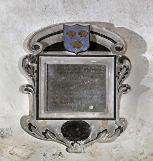<b class=qtipBold><figcaption>St Marys Kempley DP114614</figcaption></b><br>St Mary's Church, Kempley, Gloucestershire. Detail view of a wall monument showing three hedgehogs within a shield at the top. Photographed in 2010.<br><em>© Historic England Archive</em> St Marys Kempley DP114614