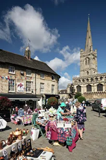<b class=qtipBold><figcaption>Stamford DP217277</figcaption></b><br>Red Lion Street, Stamford, South Kesteven, Lincolnshire. The square during a street market, from the south-east, with All Saints church in the background, August 2017.<br><em>© Historic England Archive</em> Stamford DP217277